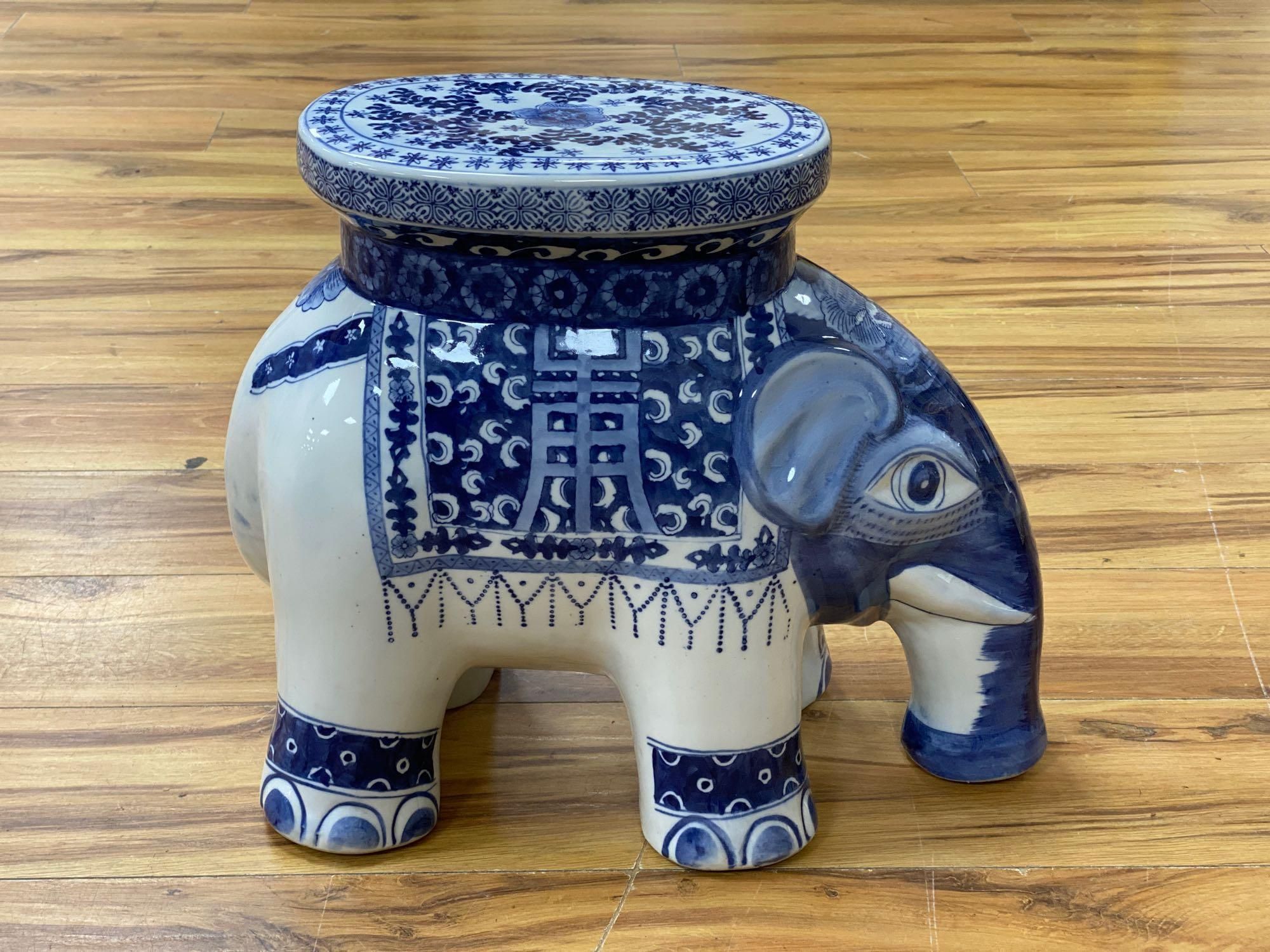 A Chinese blue and white ceramic garden seat and a similar elephant seat, 47.5cm tall